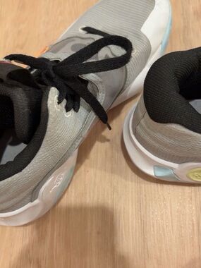Nike Gray and Black Kids' Sneaker with Subtle Pastel Accents